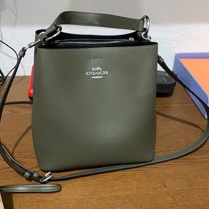 Coach purse. Shoulder and crossbody style with matching phone wallet.